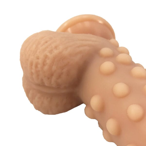 Beige silicone dildo with textured design for fantasy play
